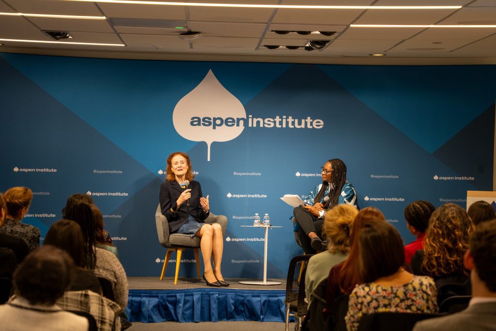 Henrietta Fore on the right and Lola Adedokun on the left sit on the Aspen Institute's stage